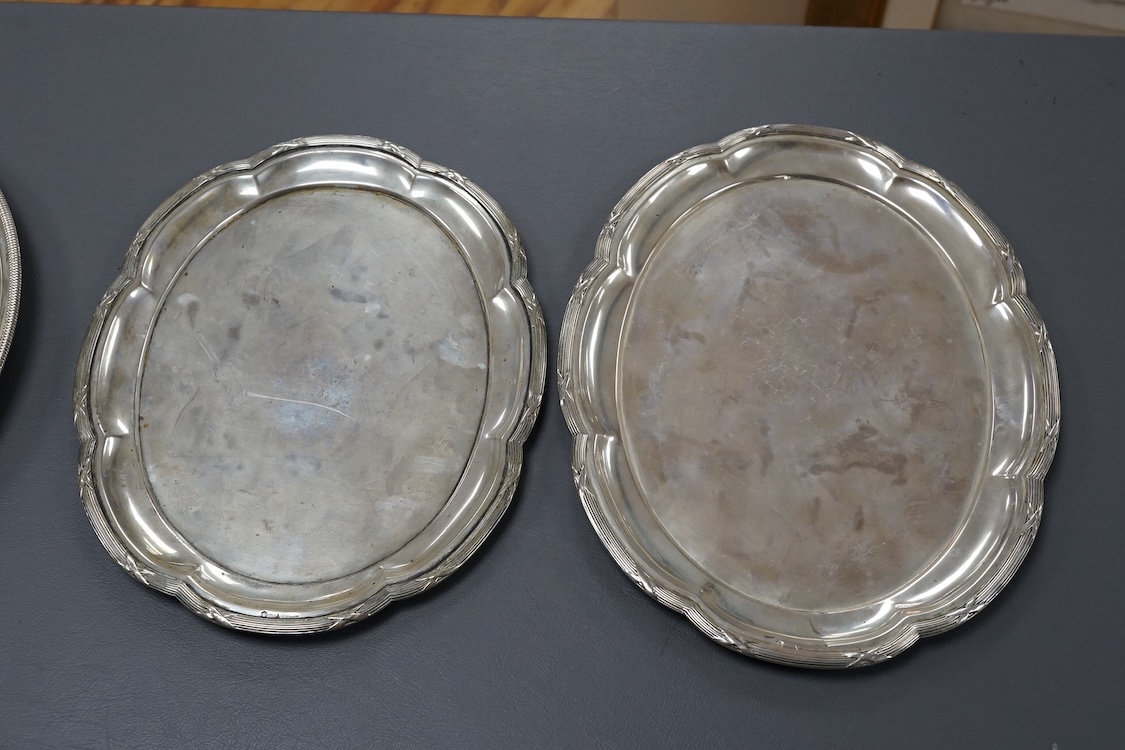An Italian 800 standard white metal shallow plate with glass insert diameter 30.2cm, together with two Austro-Hungarian 800 standard white metal shaped oval dishes, 40.1oz.